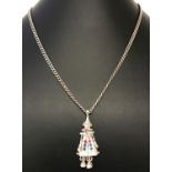 An articulated silver clown pendant set with coloured stones on a 26" curb chain.