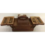 A small wooden cantilever jewellery box and contents.