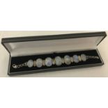 A modern design silver and moonstone bracelet. Set with 7 oval cut graduating stones.