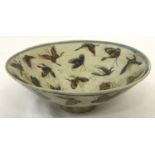 A Chinese porcelain bowl with butterfly decoration to inner and outer bowl.