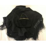 A black silk evening scarf with fringed ends together with a vintage beaded evening bag.