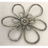 A silver modern design large flower brooch.