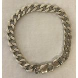 An 8 inch heavy curb chain bracelet with lobster style clasp.