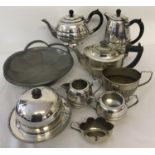 A box of silver plate and pewter tea and tableware.