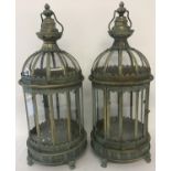 A Pair of modern Eastern style metal and glass panel lanterns with hinged doors.