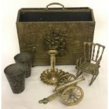 A vintage brass magazine rack together with a small collection of assorted metal ware ornaments.