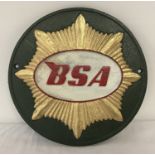 A cast metal BSA Motorcycles, circular shaped wall hanging plaque.