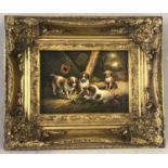 An oil painting of 4 King Charles spaniels in an ornate gilded frame.