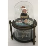 An ornamental dome topped, swimming fish mechanical clock.