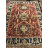 A vintage rug of 100% New Zealand wool.In rich coloured pattern with maroon border and fringed ends.