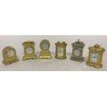 6 miniature gold tone ornamnetla quartz clocks.