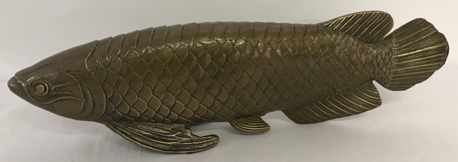 A large brass figurine of a Koi carp.
