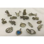 16 vintage silver and white metal charms.