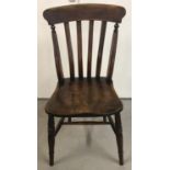 A dark wood slat back kitchen/hall chair, with turned rear struts and legs.