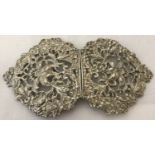 A floral and bird design pierced work silver buckle.