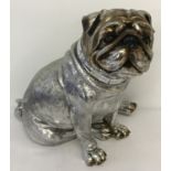 A modern silver coloured figurine of a pug dog with glass mirrored collar.