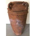 A large four handled terracotta garden urn.