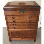 An oriental camphor wood cutlery chest with carved Fu Bat symbols to front and top.