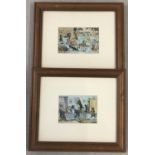 A pair of Louis Wain cat prints in modern wooden frames.