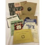 A collection of vintage square dance sheet music and 78 records.