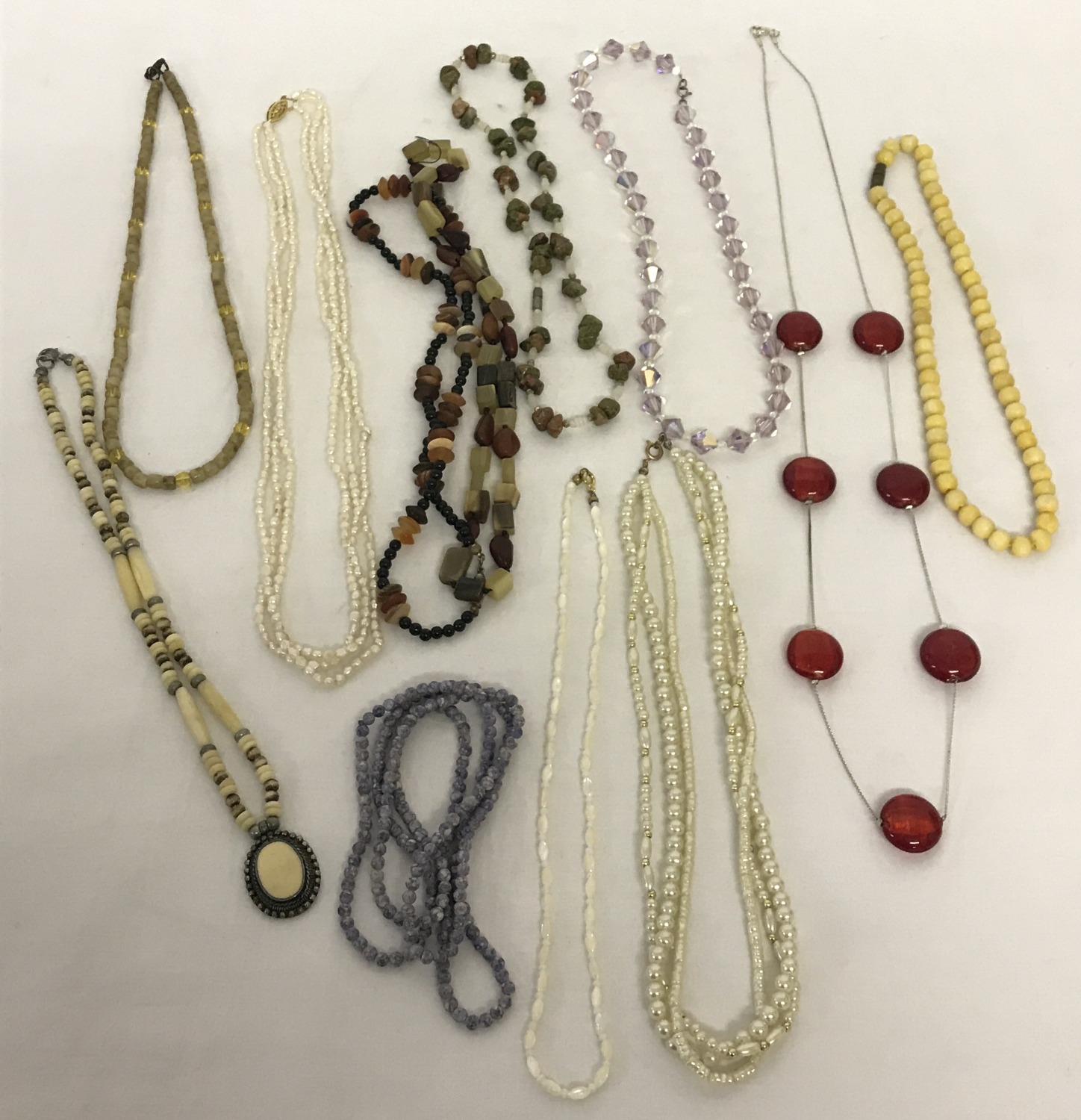 A quantity of vintage costume jewellery necklaces and beads.