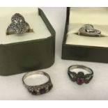 4 vintage silver dress rings, all stone set.