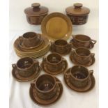 A quantity of Retro Portmeirion "Totem" pattern dinner ware, in brown colourway.