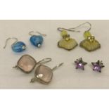 Four pairs of ladies earrings. 3 drop style together with a pair of star shaped studs.