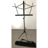 A metal music stand in a soft carrying case.