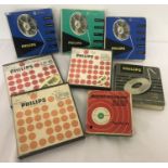 8 vintage recorded reel to reel spools, of various sizes. 7 by Philips, 1 BASF.