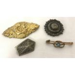 4 vintage brooches in varying metals and designs, clasp is missing to one.