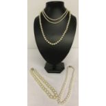 4 vintage faux pearl necklaces all with decorative clasps. One marked 925.