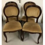 A set of 4 modern dark wood balloon back chairs with cabriole style front legs
