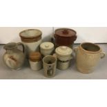Seven assorted glazed stoneware jars, some lidded.