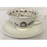 A porcelain "Fortune Telling" cup and saucer with printed detail in black and red.