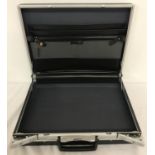 A vintage Regent attaché case in black and chrome, with keys.