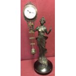 A bronze based figural, swinging pendulum mystery clock.