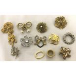 A small quantity of brooches and scarf clips in gold and silver tones, to include stone set.