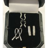 3 pairs of stone set white gold earrings.