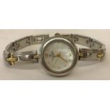 A ladies wristwatch by Clyda, Paris. Silver and gold tone bracelet with mother of peral face.