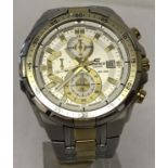 A men's "Ediface" chronograph wrist watch by Casio. Silver and gold tone bracelet.