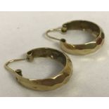 A pair of 9ct gold honeycomb patterned hoop earrings.