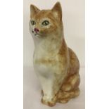 A Raymond Potteries ceramic figurine of a ginger cat.