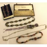 A collection of 6 boxed and unboxed vintage and modern necklaces.