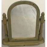 A modern dressing table swing mirror in pine with green lime wash.