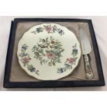 A ceramic Aynsley cake plate and knife with floral decoration.