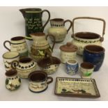 A box of 15 assorted pieces of Torquay motto-ware Pottery.