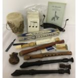 An assortment of musical items to include recorders.