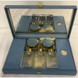 A vintage blue metal cased vanity set.