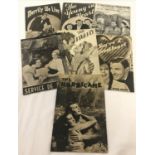 A collection of vintage Cinegram Film preview magazines.